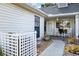 Inviting front porch with rocking chairs, decorative plants, and a peaceful ambiance at 106 Baytree Blvd, Tavares, FL 32778