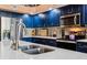 Gourmet kitchen featuring stainless steel appliances, updated countertops, and stylish cabinetry at 106 Baytree Blvd, Tavares, FL 32778