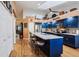 Spacious kitchen features a large island, ample seating, and modern appliances at 106 Baytree Blvd, Tavares, FL 32778