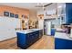 Modern kitchen featuring a large island, stainless steel appliances, and ample cabinet space at 106 Baytree Blvd, Tavares, FL 32778