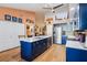 Modern kitchen with a large island, stainless steel appliances, and an open layout at 106 Baytree Blvd, Tavares, FL 32778