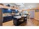 Bright kitchen boasts an island with seating, modern appliances, and abundant counter space at 106 Baytree Blvd, Tavares, FL 32778