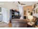 Open concept living room features wood floors, built-in shelves, and ample lighting at 106 Baytree Blvd, Tavares, FL 32778