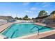 A refreshing community pool surrounded by lounge chairs and featuring a shallow entrance area at 106 Baytree Blvd, Tavares, FL 32778