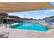 Community pool featuring a brick patio, bright blue water, and shade coverings for residents' enjoyment at 106 Baytree Blvd, Tavares, FL 32778
