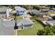 This aerial shot highlights the home's backyard, garage, and fence-lined property at 1109 W Line St, Leesburg, FL 34748