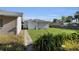 Spacious backyard features a detached garage with a lush lawn and partial fencing at 1109 W Line St, Leesburg, FL 34748