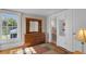 Bedroom featuring wood dresser, mirror, and an ensuite bathroom at 1109 W Line St, Leesburg, FL 34748