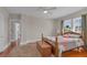 Bedroom with hardwood floors featuring natural light and neutral paint scheme at 1109 W Line St, Leesburg, FL 34748