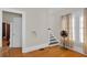Bedroom with hardwood floors features an open doorway and natural light at 1109 W Line St, Leesburg, FL 34748