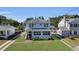Charming two-story home with landscaped yard and inviting front porch showcasing curb appeal at 1109 W Line St, Leesburg, FL 34748