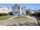 This shot highlights the home's patio, driveway, and well-manicured lawn at 1109 W Line St, Leesburg, FL 34748