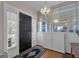 Elegant foyer with hardwood floors, a decorative chandelier, and built-in shelving at 1109 W Line St, Leesburg, FL 34748