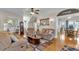 Comfortable living room with hardwood floors and a staircase, adjacent to the dining area at 1109 W Line St, Leesburg, FL 34748