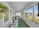 Relaxing covered porch with rocking chairs and views of the surrounding neighborhood at 1109 W Line St, Leesburg, FL 34748