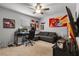 Cozy bedroom with fan and gaming setup, offering a personal space at 1128 Cavender Creek Rd, Minneola, FL 34715