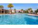 A beautiful community pool with lounge chairs and a splash pad area for  at 1128 Cavender Creek Rd, Minneola, FL 34715
