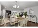 Inviting dining area connects to the kitchen and living room, with neutral decor and ample seating at 1128 Cavender Creek Rd, Minneola, FL 34715