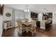 Charming dining area featuring a modern table setting adjacent to the kitchen with granite countertops at 1128 Cavender Creek Rd, Minneola, FL 34715
