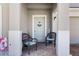 Inviting front porch featuring comfortable seating, decorative accents, and a welcoming entrance at 1128 Cavender Creek Rd, Minneola, FL 34715
