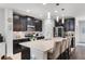 Modern kitchen featuring granite countertops, stainless steel appliances, and ample cabinet space at 1128 Cavender Creek Rd, Minneola, FL 34715