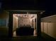 Outdoor patio area is lit with string lights and has a ceiling fan for added comfort at 1128 Cavender Creek Rd, Minneola, FL 34715