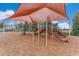 Outdoor playground with slides, climbing features, and soft mulch ground cover at 1128 Cavender Creek Rd, Minneola, FL 34715