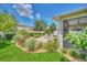 Serene backyard with a patio, screened lanai, lush landscaping, and a well-manicured lawn at 1281 Gatewood Ave, Minneola, FL 34715