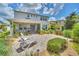 Beautiful backyard with a screened-in lanai, patio, and lush greenery for ultimate relaxation and privacy at 1281 Gatewood Ave, Minneola, FL 34715