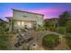 Gorgeous backyard featuring a screened-in lanai, patio, and manicured landscaping for outdoor enjoyment at 1281 Gatewood Ave, Minneola, FL 34715