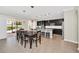 Modern kitchen with dark cabinetry, stainless appliances, and a spacious island at 1281 Gatewood Ave, Minneola, FL 34715
