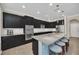 Well-equipped kitchen boasts a large island, stainless steel appliances, and modern finishes at 1281 Gatewood Ave, Minneola, FL 34715