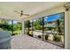 Enclosed patio area offering a grill and serene views of the well-manicured backyard at 1281 Gatewood Ave, Minneola, FL 34715
