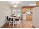 Bright dining room with table, chairs, and natural light, located near kitchen and outdoor area at 13050 Se 120Th St, Ocklawaha, FL 32179