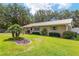 Inviting single-story home with a metal roof, landscaped yard and great curb appeal in a serene setting at 13050 Se 120Th St, Ocklawaha, FL 32179