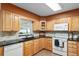 Bright kitchen with maple cabinets, black countertops, and modern appliances at 13050 Se 120Th St, Ocklawaha, FL 32179