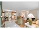 Bright living room featuring tile floors that flow into the kitchen and dining area at 13050 Se 120Th St, Ocklawaha, FL 32179