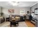 Relaxing living room featuring hardwood floors, and large windows for natural light at 13050 Se 120Th St, Ocklawaha, FL 32179