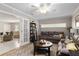Comfortable living room with stylish decor and a view to the kitchen through French doors at 13050 Se 120Th St, Ocklawaha, FL 32179