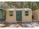 A compact, well-maintained storage shed with a secure door and functional windows for organization at 13050 Se 120Th St, Ocklawaha, FL 32179