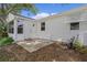 Backyard features a small patio and door to the exterior at 1358 E Schwartz Blvd, The Villages, FL 32159