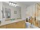 Bathroom featuring a granite vanity, walk-in shower with curtain and direct access to the bedroom at 1358 E Schwartz Blvd, The Villages, FL 32159