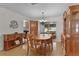 Traditional dining room featuring wood furniture and light hardwood floors at 1358 E Schwartz Blvd, The Villages, FL 32159