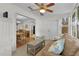 Cozy living room with tile floors and view into the dining room at 1358 E Schwartz Blvd, The Villages, FL 32159