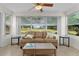 Cozy living room filled with light from the large picture window at 1358 E Schwartz Blvd, The Villages, FL 32159