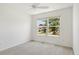 Bright bedroom featuring a ceiling fan and large window for ample sunlight at 1409 Gatlin Pl, The Villages, FL 32163