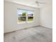 Bedroom featuring a ceiling fan and window with neighborhood view at 1409 Gatlin Pl, The Villages, FL 32163