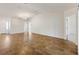 Bright and airy living room showcasing vaulted ceilings and ample space at 1409 Gatlin Pl, The Villages, FL 32163