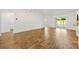 Open concept living room features beautiful wood floors and bright natural light at 1409 Gatlin Pl, The Villages, FL 32163