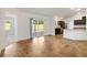 Open living area connecting to the kitchen and featuring sliding glass doors to the patio at 1409 Gatlin Pl, The Villages, FL 32163